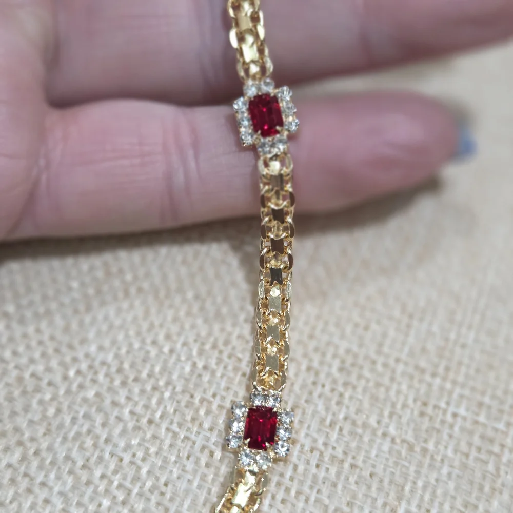 Elegant Gold Bracelet with Ruby Accents